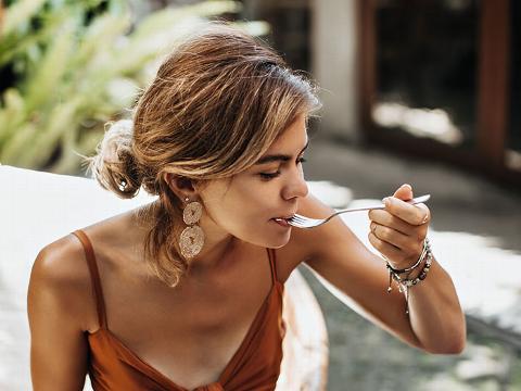 lady eating with a fork